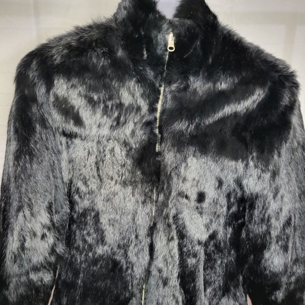 Willson leather rabbit Fur reversible coat. The inside pocket is mildly torn.